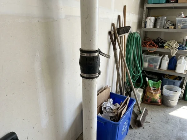 Cracked rubber coupling on a radon pipe