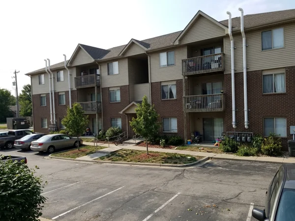Multifamily apartment building with radon vent pipes